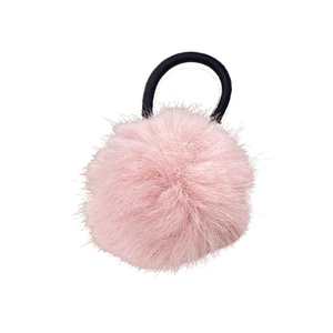 Pink plush pom pom hair tie with black elastic band for women on white background