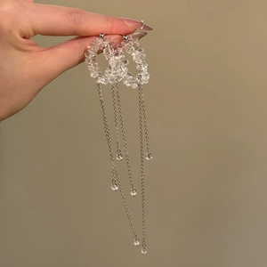 Elegant long fringe tassel earrings featuring irregular crystals and silver-tone metal chains