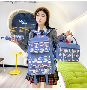 Close-up of lightweight nylon backpack set with unicorn pattern, handbag and pencil case
