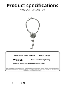 Detail of silver floral necklace with long tassels and electroplated steel chain texture
