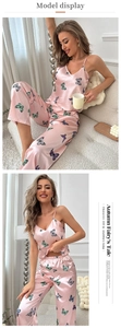 Silky pink pajama set for women featuring camisole top and pants with butterfly prints