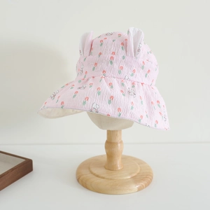 Detail of pink tulip and bunny print sun hat with 3D ears and ruffled brim for girls
