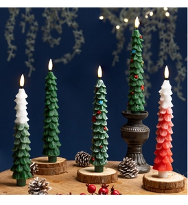Detailed view of LED Christmas tree candles with realistic wax texture and warm light