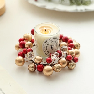 Christmas candle holder with red berry wreath and aromatherapy glass candle ornament