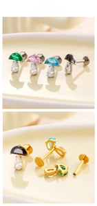 Macro detail of titanium mushroom labret studs with colorful semi-round zirconia stones