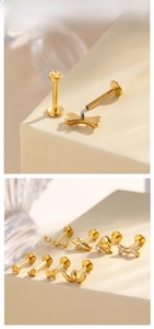 Gold titanium flat back labret studs featuring butterfly heart and angel wing designs