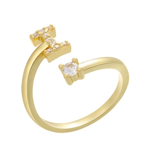 Macro detail of adjustable gold plated ring with micro zircon letter I and round crystal