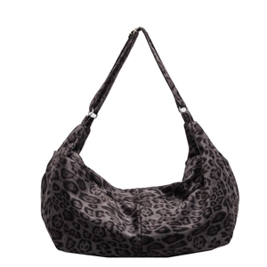Grey leopard print PU leather crescent shoulder bag with adjustable strap on white background
