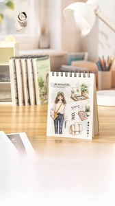 Detail of professional-themed sticker book featuring spiral binding and cute illustrations