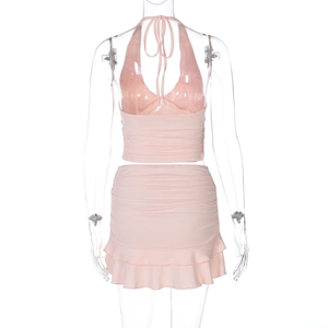 Detail view of pink halter top and ruffle mini skirt set on transparent mannequin