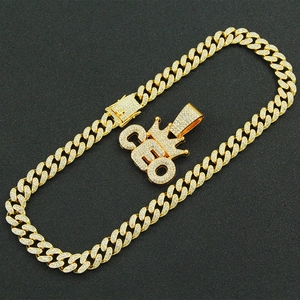 Men's hip hop gold Cuban chain necklace with iced out CEO crown pendant in black background