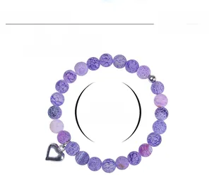 Detail of 8mm purple weathered agate bead bracelet with silver heart charm and size info