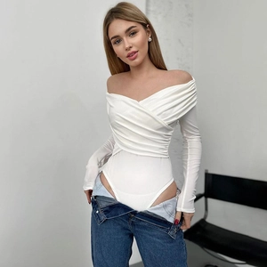 Detail of white off-shoulder bodysuit with wrap-front design and smooth stretch fabric