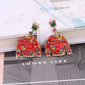 Festive Christmas ugly sweater earrings with colorful crystals and power plug ear hooks
