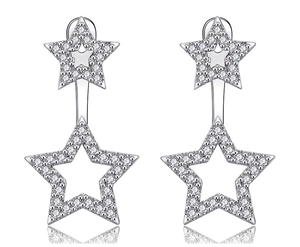 Macro shot of silver S925 star earrings with sparkling cubic zirconia pavé detailing