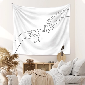 Detail of minimalist line art tapestry with touching hands on a modern bedroom wall