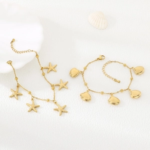Gold stainless steel ocean themed jewelry set with starfish pendants and shell bracelet