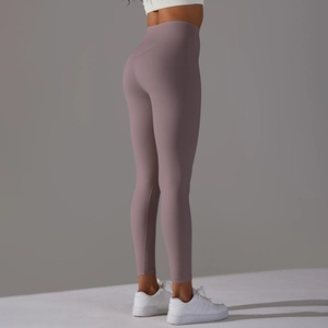 Side view of high-waisted mauve yoga pants showing butt-lifting and seamless fit
