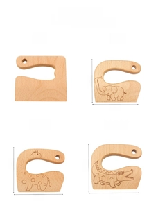 Detailed macro view of smooth wooden animal-shaped cutters with fine carved textures