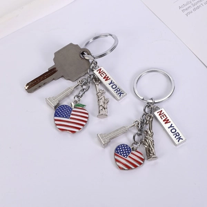 Detail of New York souvenir keychains featuring Statue of Liberty and US flag heart charms