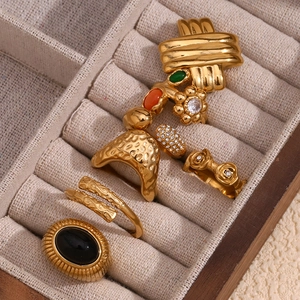 Set of 18K gold plated stainless steel rings with floral and hammered textures in box