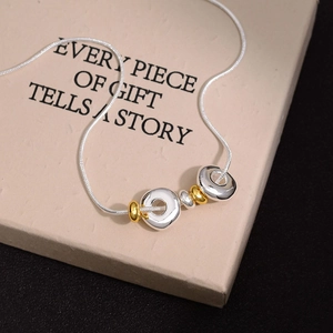 Elegant gold and silver ring pendant necklace with snake chain on premium gift box