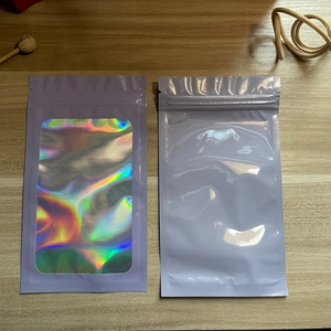 Detail view of purple laser holographic resealable bags for jewelry on wooden surface