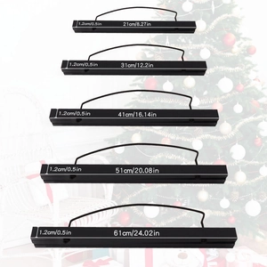 Detailed view of five sizes of black magnetic poster hangers in solid wood minimalist style