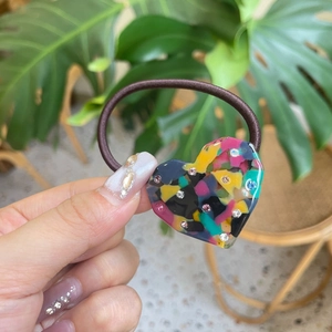 Brown elastic hair tie with colorful resin heart pendant and tiny sparkling rhinestones