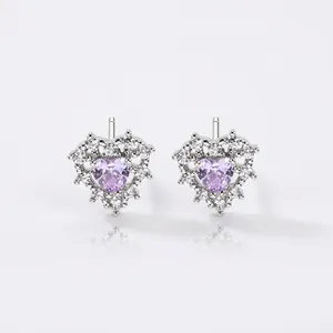 Silver heart earrings with purple heart-shaped stone and white cubic zirconia surround