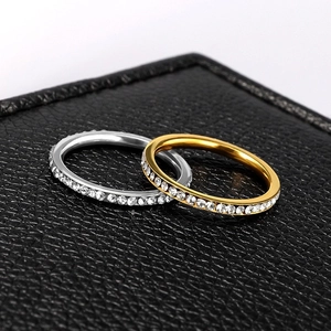 Detailed macro shot of 2mm gold and silver titanium steel rings with cubic zirconia
