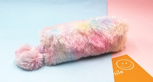 Detail of soft rainbow plush pencil case with fluffy texture and matching pompom charm