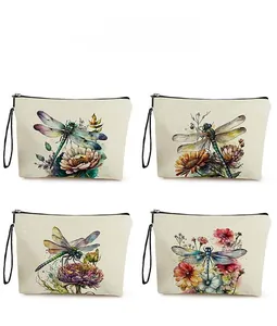 Detailed pattern display of canvas dragonfly makeup bags with floral watercolor designs