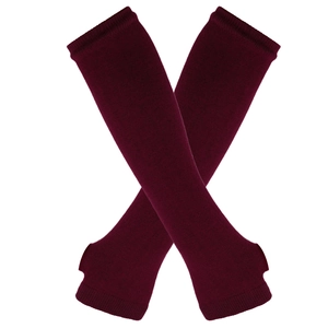 Close-up of burgundy knitted arm warmers with thumb holes and fine texture detail