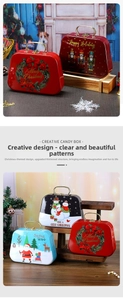Macro shot of retro Christmas suitcase metal candy boxes with festive holiday patterns