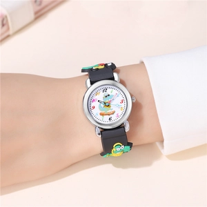 Detailed view of child wearing black dinosaur sports watch with silicone strap