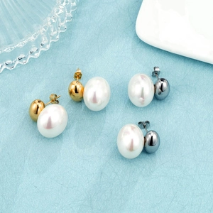 Detailed view of large button pearl earrings in both gold and silver plating finishes