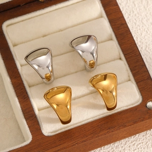 Polished stainless steel C-shape earrings in gold and silver finish displayed in a box