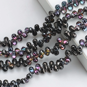 Detailed view of teardrop black glass crystal beads with rainbow electroplated finish