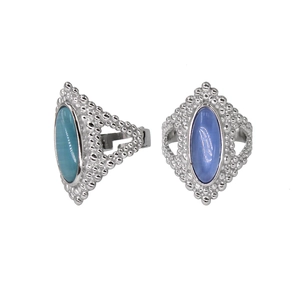 Detail of silver bohemian open rings with cyan and blue oval natural stones