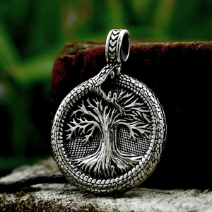 Silver stainless steel Ouroboros pendant featuring the Viking Tree of Life on stone