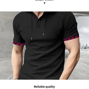 Detailed close-up of men's black waffle knit hoodie with red and blue plaid cuffs