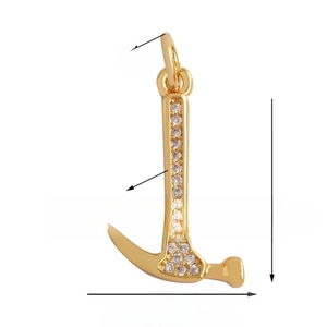 Detail view of gold hammer pendant with white crystals and precise size measurements