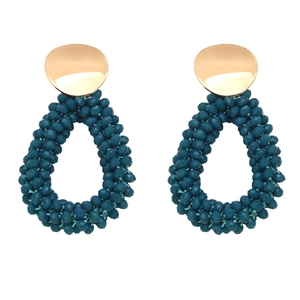 Handcrafted teardrop beaded earrings with gold metal disc and green crystal beads