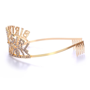 Close-up of golden rhinestone Birthday Girl crown with side combs for secure fit