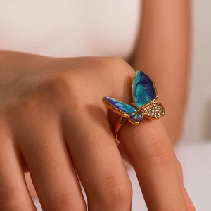 18k gold plated vintage butterfly ring with blue enamel and zircon worn on finger