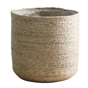 Minimalist Nordic rattan woven plant pot in natural finish with plastic lining