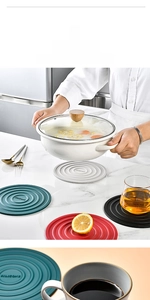 Close-up of heat-resistant round silicone trivets with non-slip concentric ring patterns