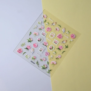 Detail of 3D embossed floral nail stickers featuring pink roses and birds on FEB-657 sheet