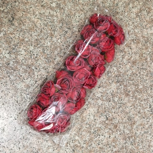 Bulk red artificial rose heads for DIY decoration sealed in clear plastic packaging